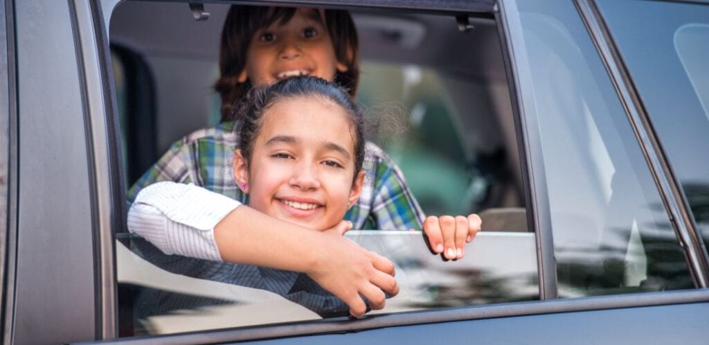 Picture of kids being transported in accordance with their parenting plan in Washington State